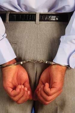 Dutchak in handcuffs